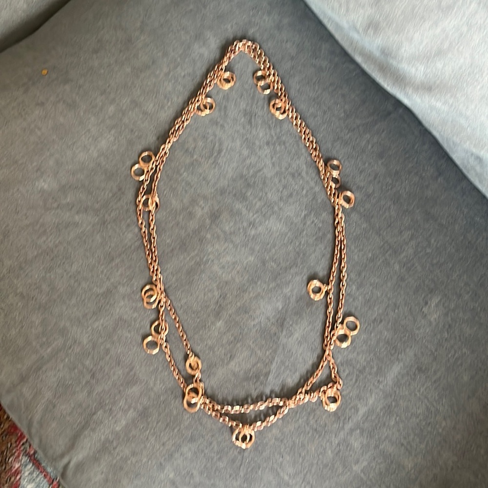 Long rose gold weighted chain.
